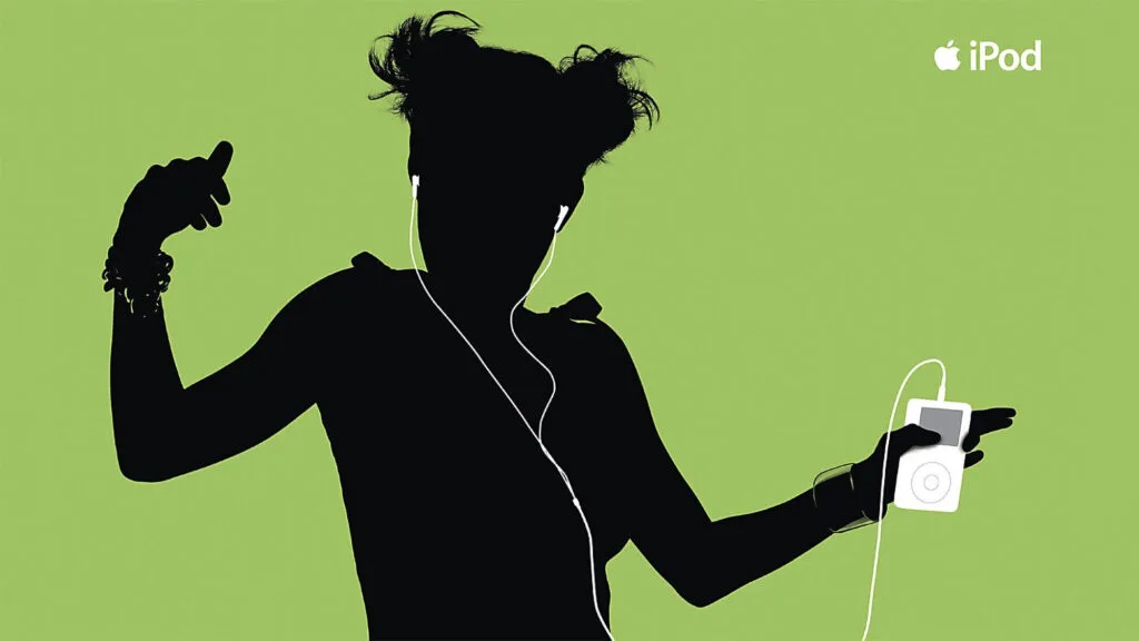 Silhouette of a person dancing against a green background, holding a white iPod with wired earbuds. Apple iPod logo in top right corner.